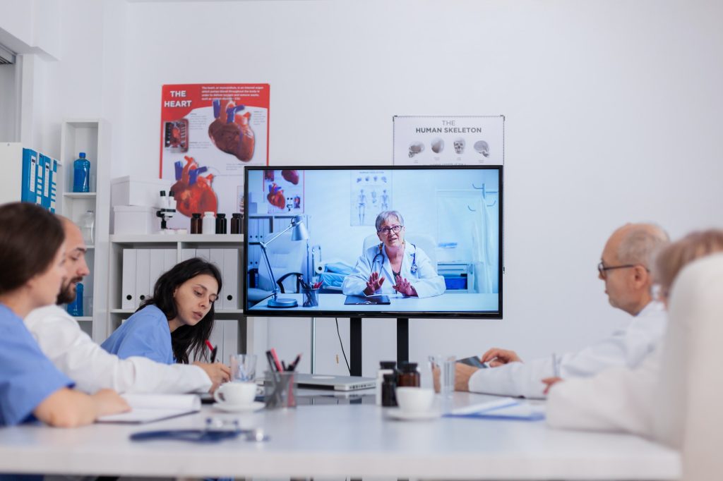 Teamwork discussing sickness treatment during online videocall telemedicine teleconference